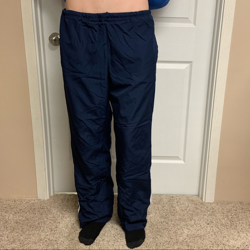 Dark blue Adidas sweatpants.
